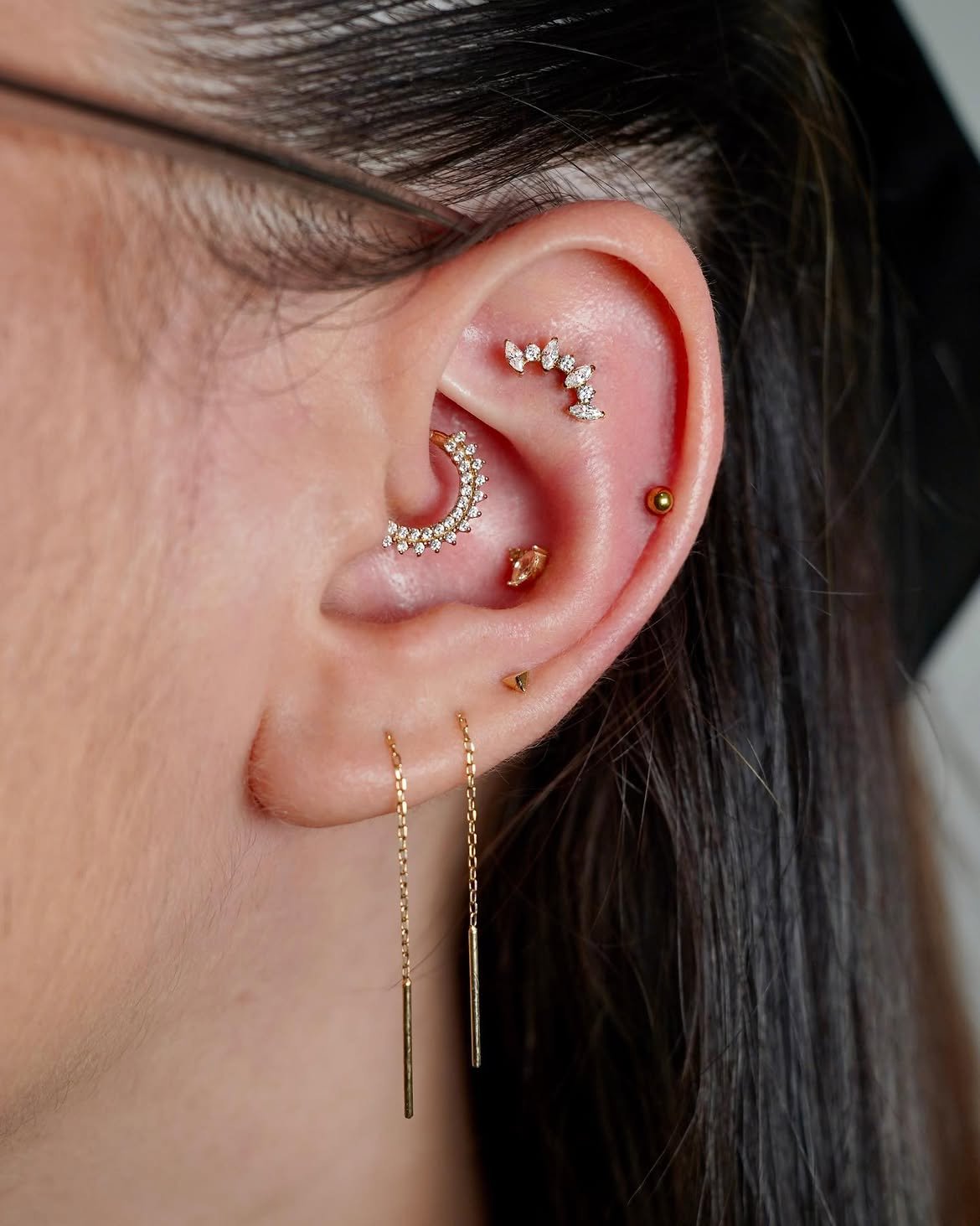 Daith piercing with gold jewelry in Barcelona - Circa Piercing